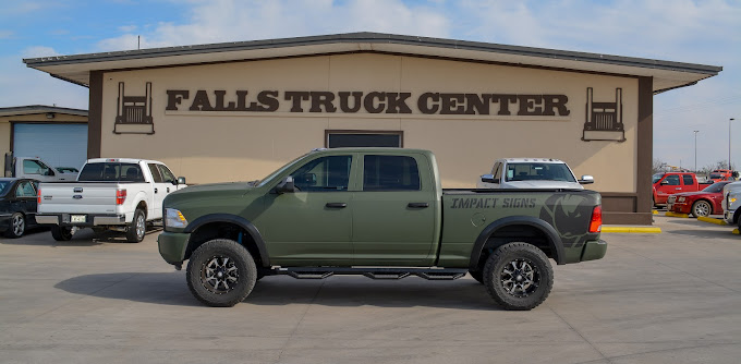 A custom die-cut business logo decal on a truck door